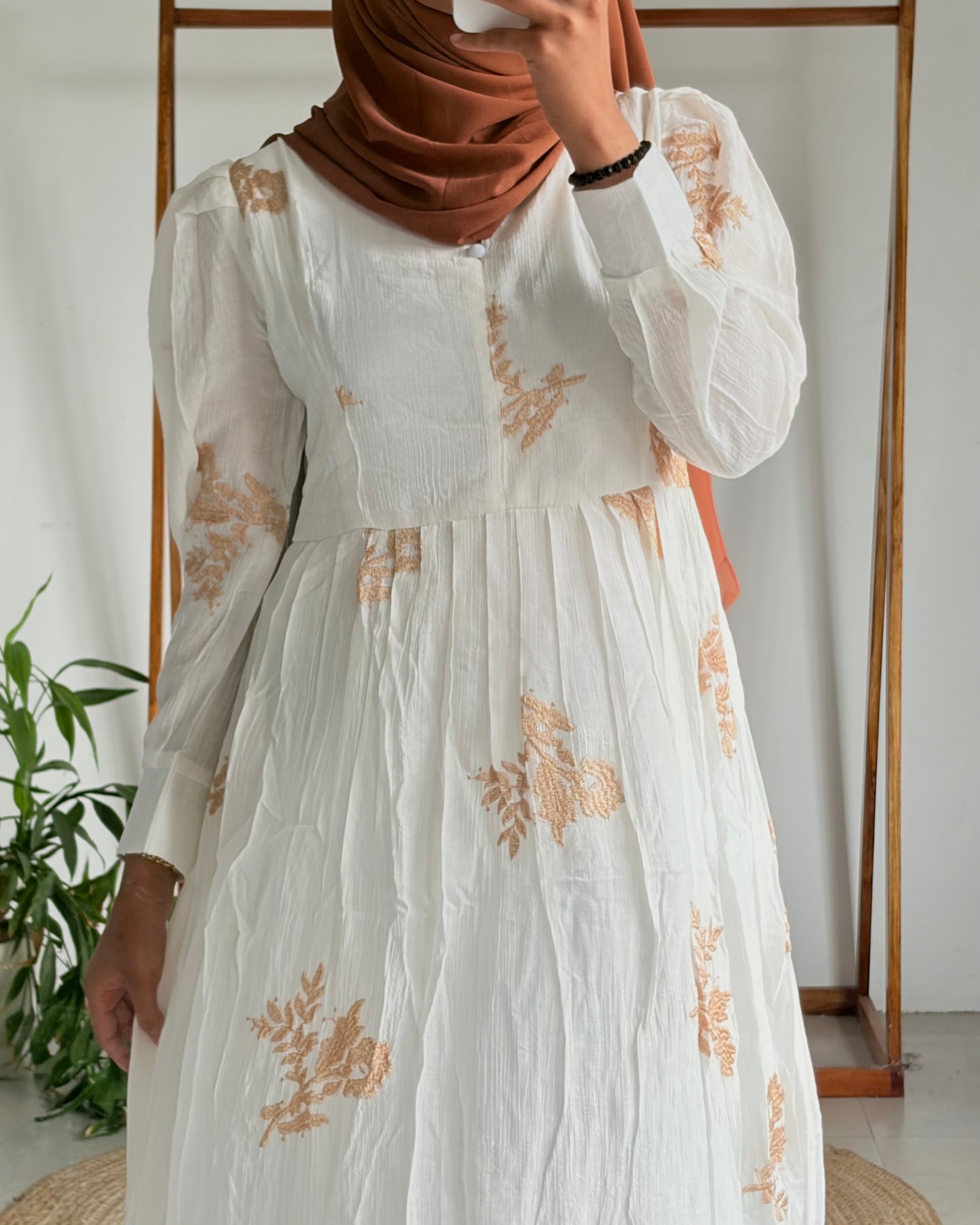 Embroidered pleated gown