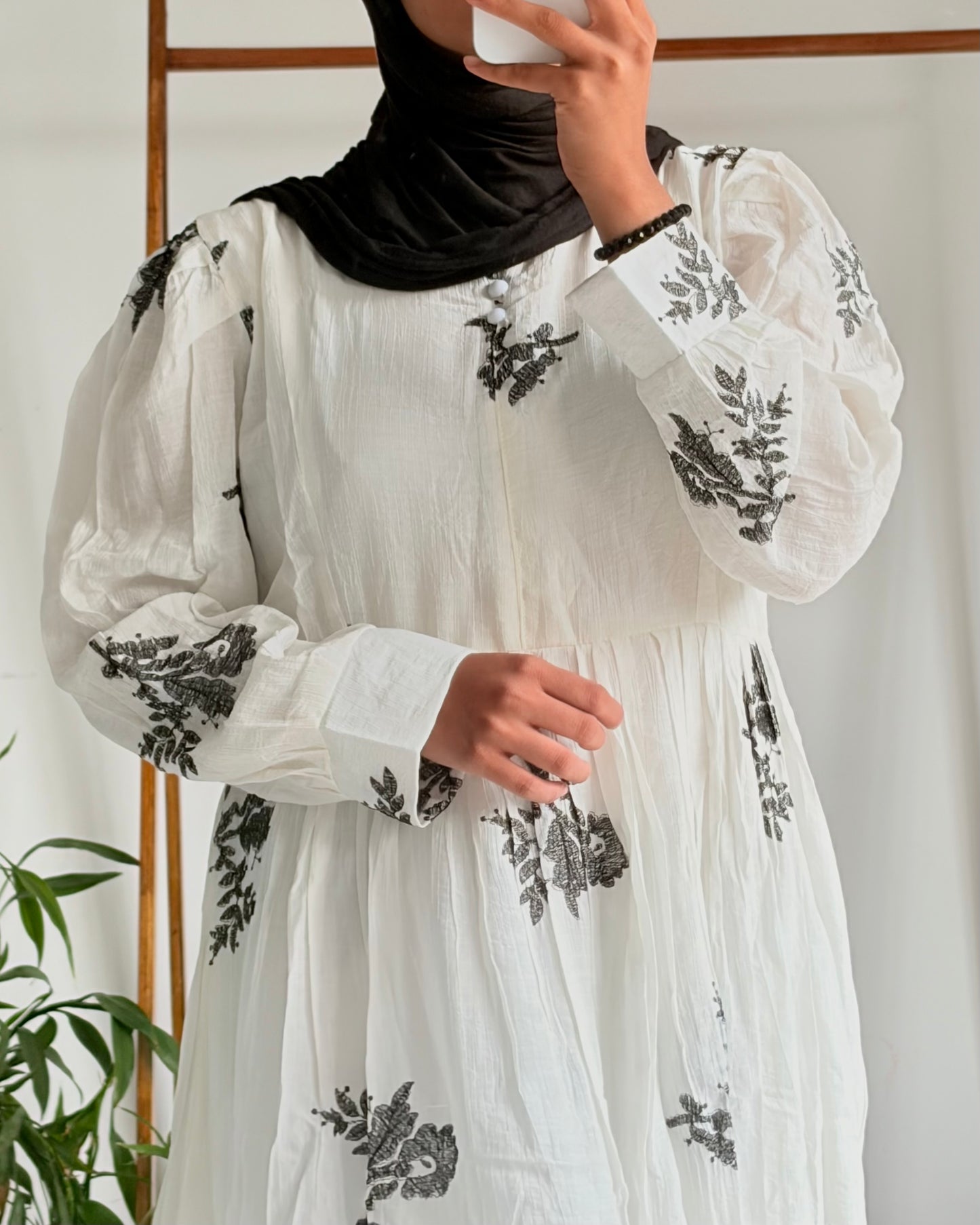 Embroidered pleated gown